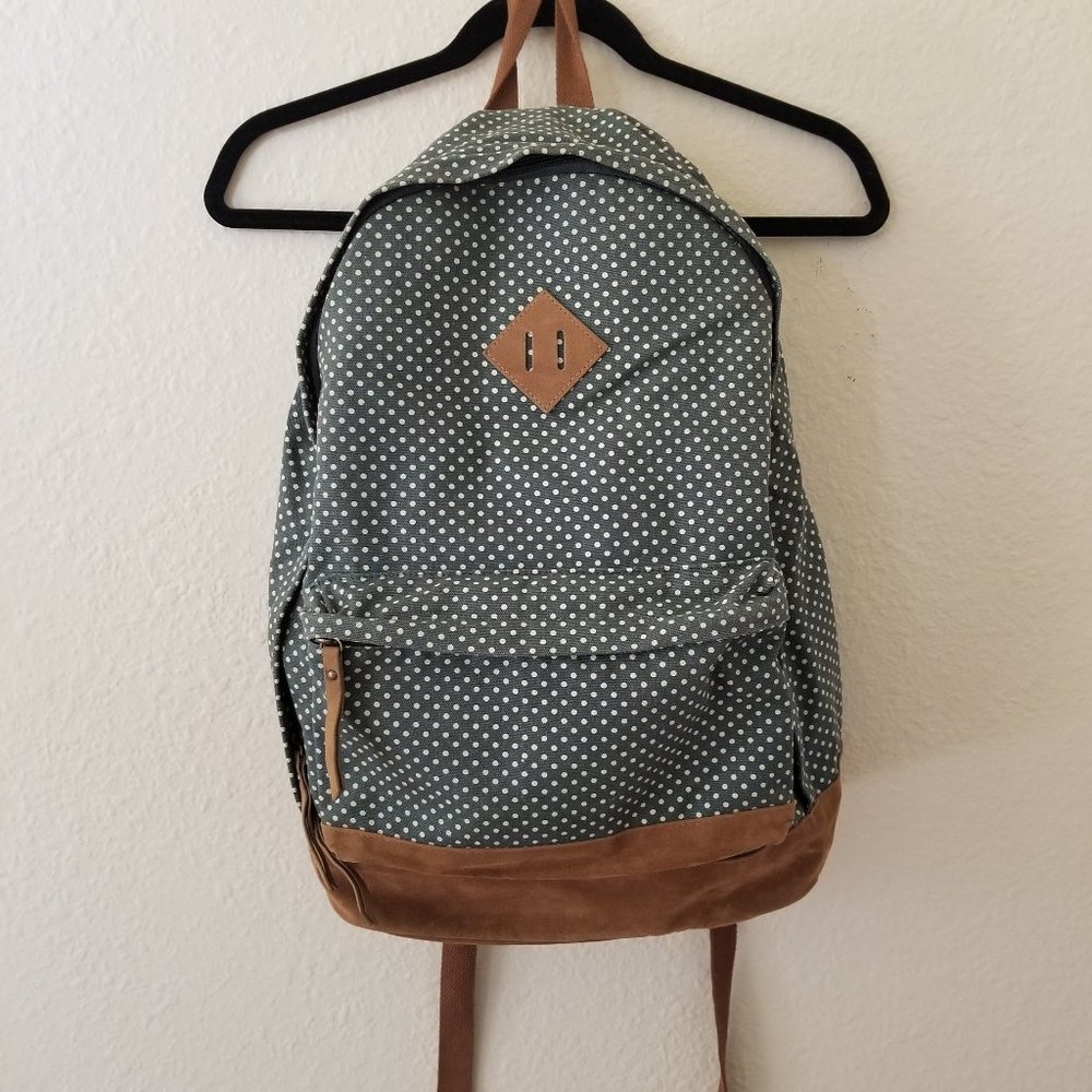green and white polka dot backpack
